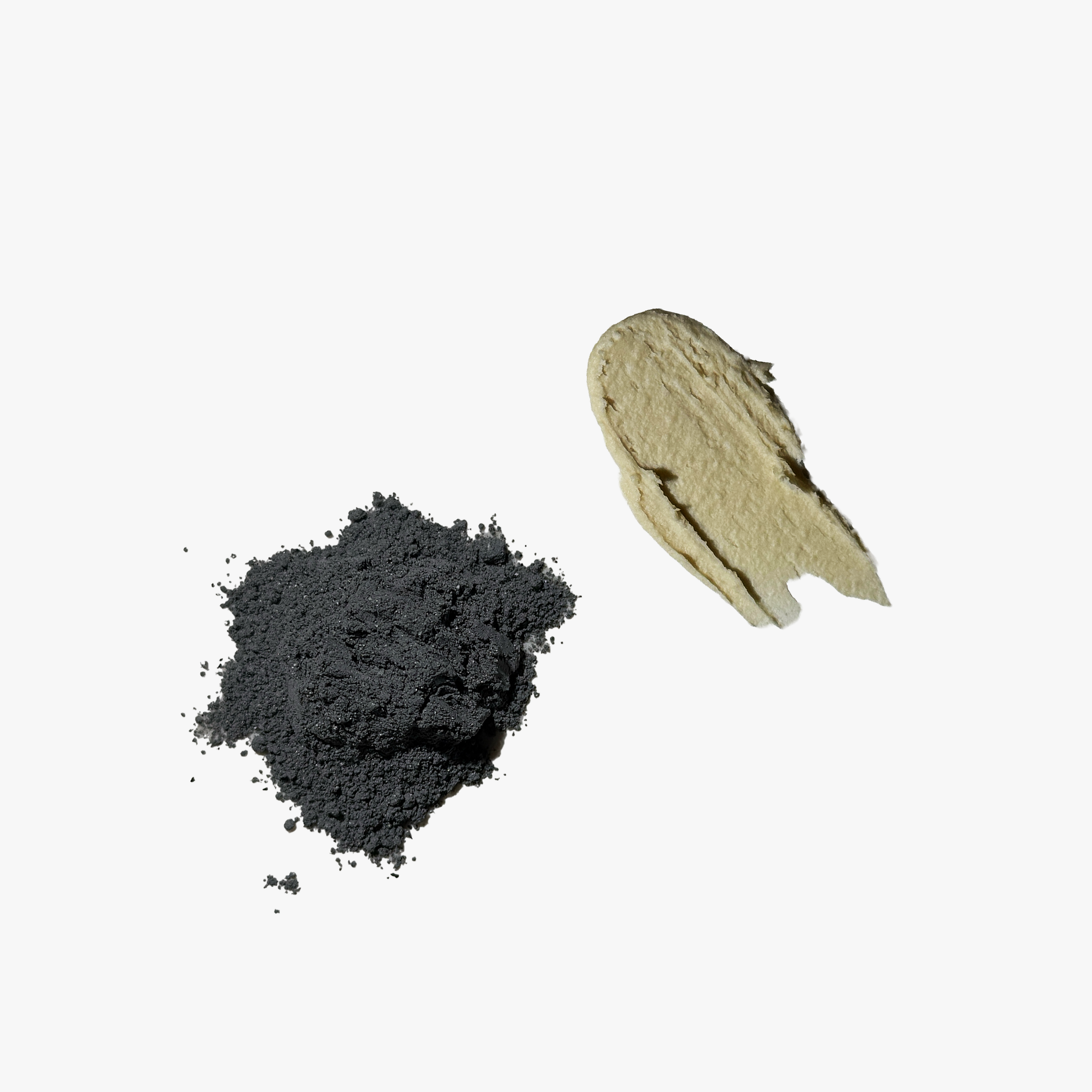 Charcoal and clay underarm detox mask mixed with water into a paste